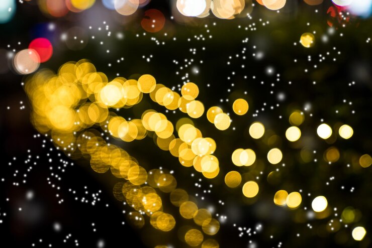 Foto bokeh naranja colorido con fondo de nieve de luces de navidad y año nuevo
