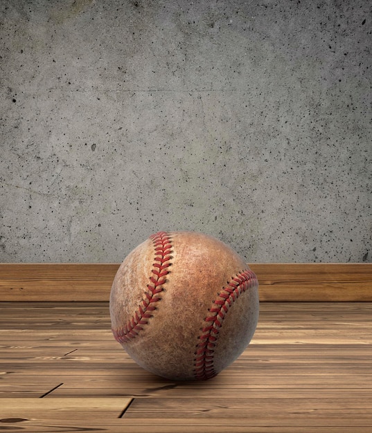 Bola de béisbol con paredes de cemento en el suelo de madera
