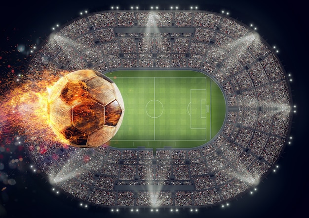 Bola de futebol com chamas de fogo sobre um estádio