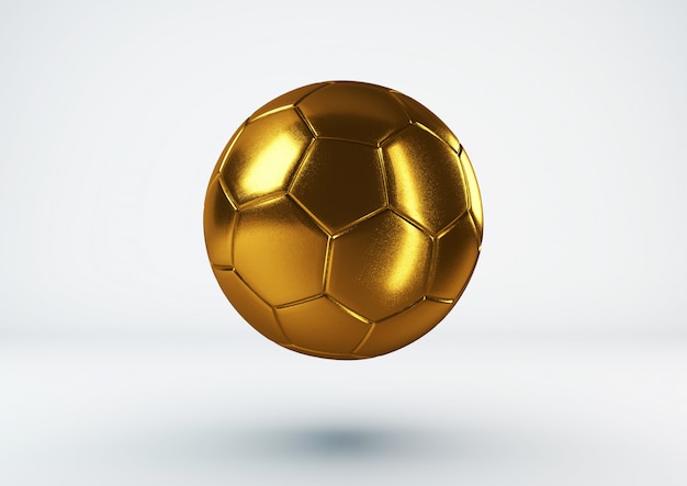 Bola de futebol de ouro na parede branca