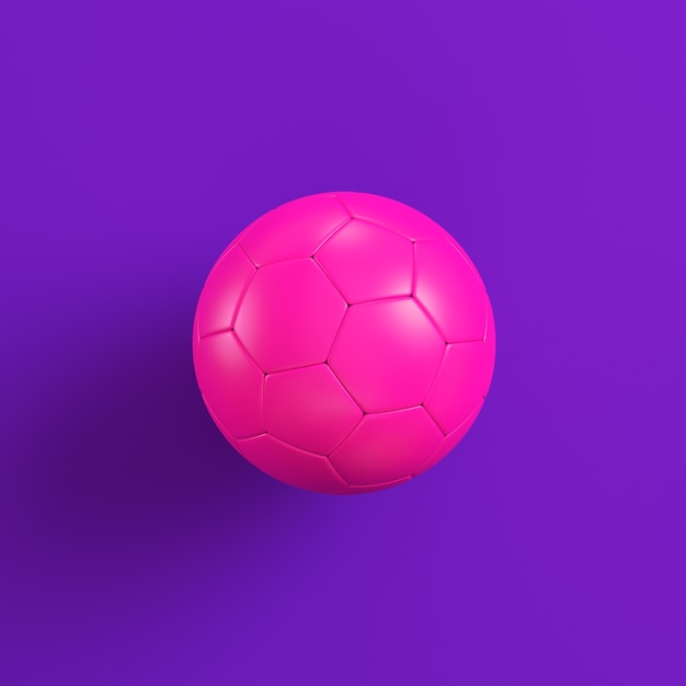 Foto bola de futebol rosa em violeta