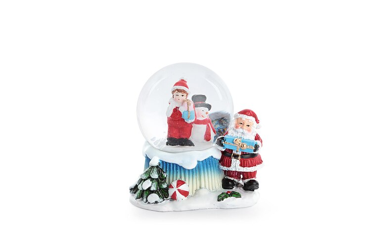 Foto bola de vidro com neve ou globo de neve. ideal para presentes ou gadgets