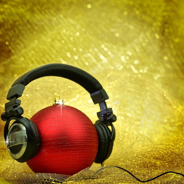 Bola de navidad con auriculares en fondo brillante