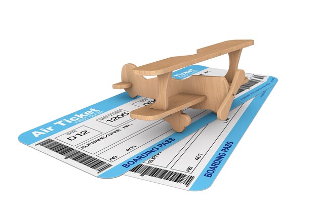 Boletos de la tarjeta de embarque de la aerolínea con avión de juguete sobre un fondo blanco.