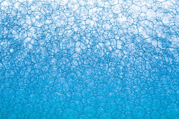 Foto bolhas de sabão macro azuis. macro close-up de bolhas de sabão parecem uma imagem científica de célula e célula