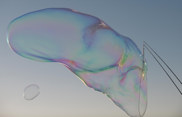 Foto bolhas enormes soprando grandes bolhas de sabão no ar conceitos de verão de liberdade