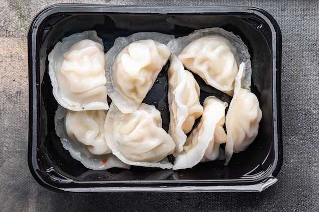 bolinhos chineses de dim sum refeição saudável lanche na mesa cópia espaço comida fundo rústico