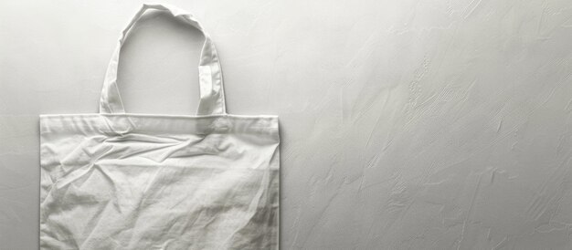 Foto bolsa blanca de tela de lona con espacio en blanco para el texto diseñada para parecerse a un saco de compras de tela