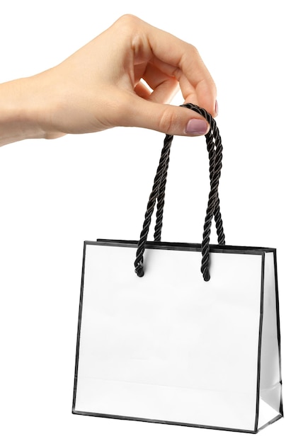 Foto bolsa de compras mano femenina sosteniendo la bolsa de compras en blanco