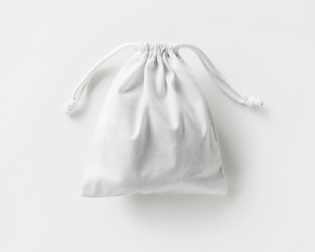 Foto bolsa de algodão ecofriendly branca com laços no fundo branco