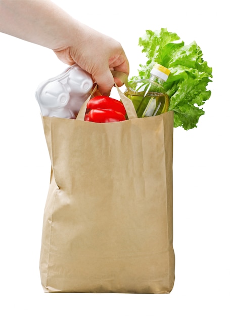 Bolsa de papel con comida en mano