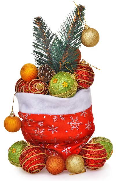 Bolsa de regalo de Papá Noel llena de juguetes con rama de árbol de Navidad