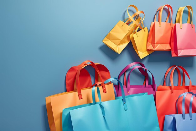 Bolsas de compras de papel coloridas aisladas sobre un fondo azul