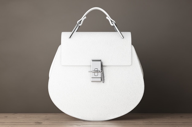 Foto bolsas femininas de couro branco de luxo em uma mesa de madeira. renderização 3d
