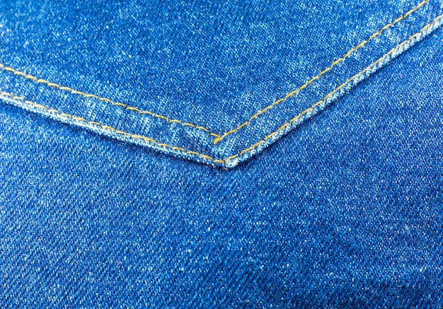 Foto bolso de material de calça jeans hippie azul. fundo de textura de pano jeans.