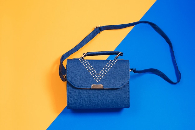 Bolso de mano en piel para mujer en azul y amarillo