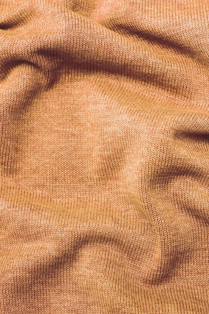 Foto borgonha peach fuzz enrugado tecido de pelúcia fundo textura padrão de material macio cor do ano 2024