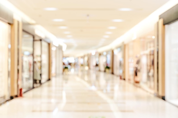 Borrão desfocado abstrato interior de shopping de loja de departamentos de luxo com conceito de fundo bokeh de design de temporadas de compras