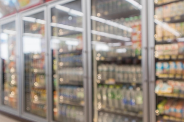 Borrão supermercado loja de conveniência geladeira produto prateleiras interior fundo desfocado