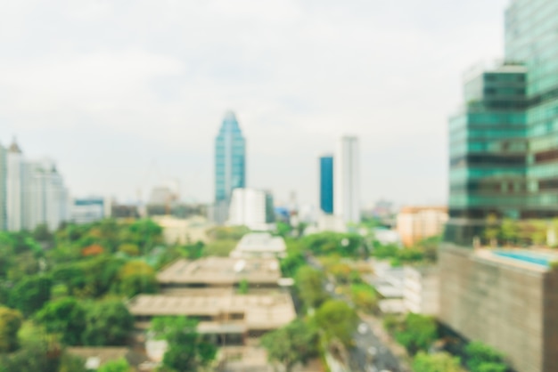 Borrosa ciudad industrial de antecedentes - Desenfoque de la ciudad de Bangkok con puesta de sol y cielo crepuscular y bokeh vista de la luz vista desde la cima del edificio. Desenfoque concepto de antecedentes.