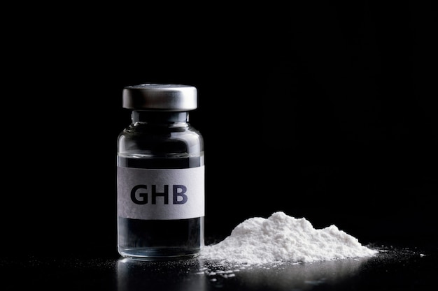 Foto botella de ghb en ghb negro