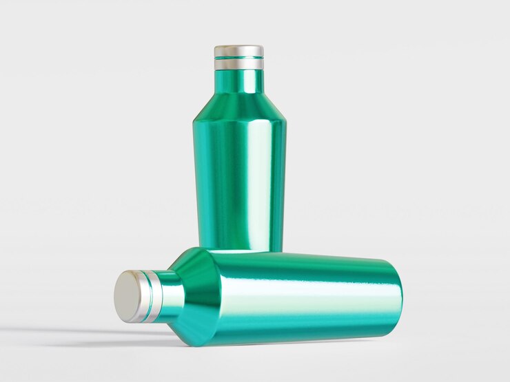 Foto una botella verde con una tapa de plata y una tapa de prata