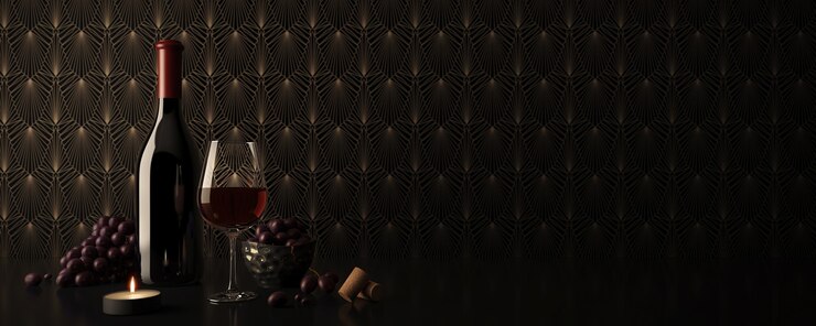 Botella de vino y copa de vino tinto con uvas