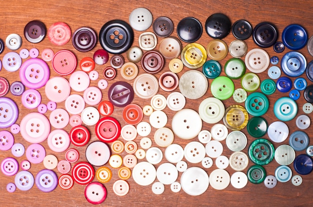 Botões coloridos como fundo de arco-íris para design
