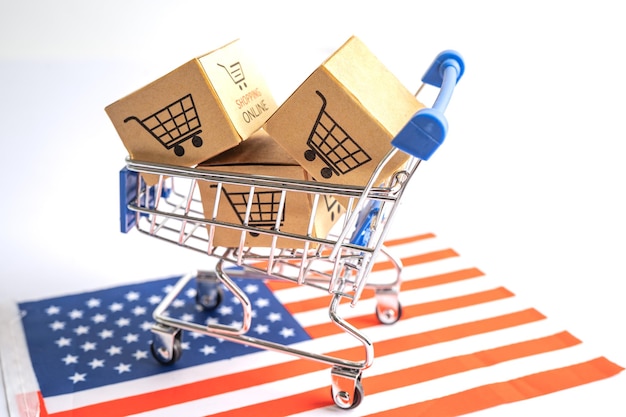 Box mit Shopping-Online-Warenkorb-Logo und USA-Amerika-Flagge Import Export Shopping Online- oder Handelsfinanz-Lieferservice Store-Produktversand Handelslieferantenkonzept