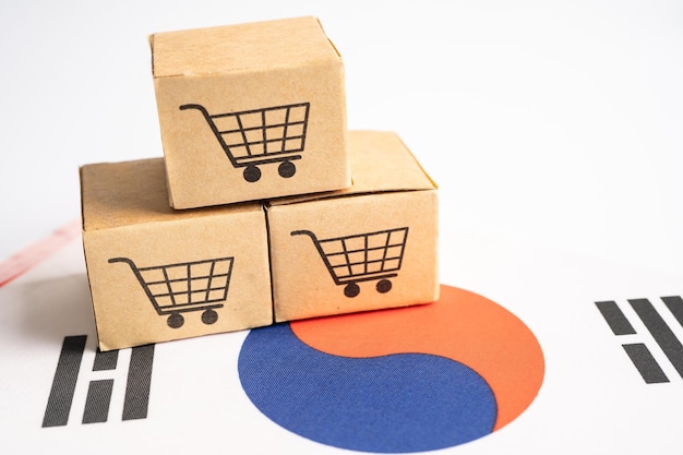 Box mit Warenkorb-Logo und Korea-Flagge Import Export Shopping online oder eCommerce Finance Delivery Service Store Produkt Versand Handelslieferant Konzept
