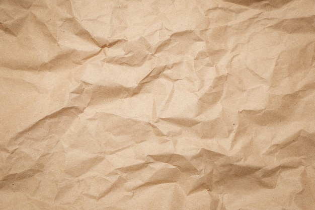 Foto braune zerknitterte papierstruktur, alte papieroberfläche als hintergrund
