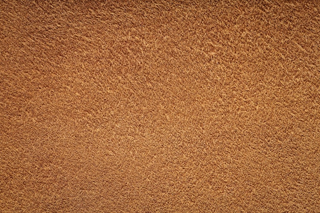 Brauner Wildleder-Texturhintergrund Chamois-Material für Stoffbeutel oder Schuhe Nahaufnahme Draufsicht