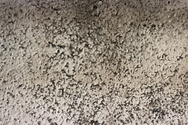 Braunes Beton- oder Zementmaterial in abstrakter Wandhintergrundtextur