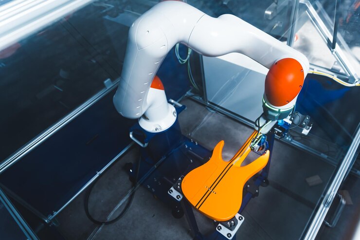 Foto el brazo robótico que controla la pintura de la guitarra tecnologías modernas pruebas de aceptación de fábrica grasa