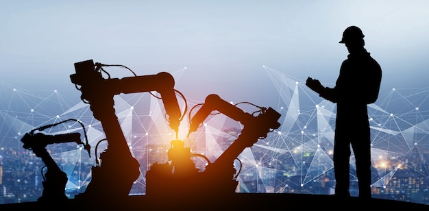 Los brazos robóticos de la industria mecanizada en la fábrica del futuro