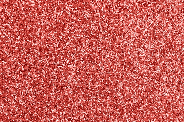 Brilho abstrato. Textura de glitter vermelho. Pano de fundo festivo