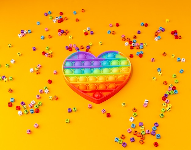 Foto brinquedo anti-stress arco-íris pop it para crianças e adultos