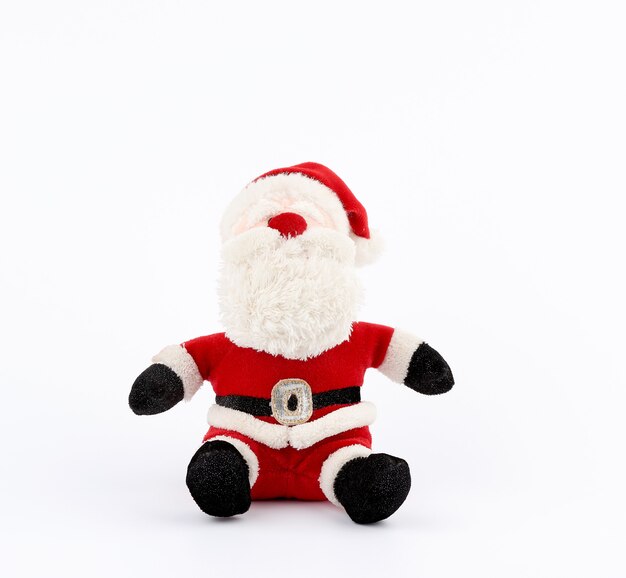 Brinquedo tradicional Papai Noel em um terno vermelho e barba branca