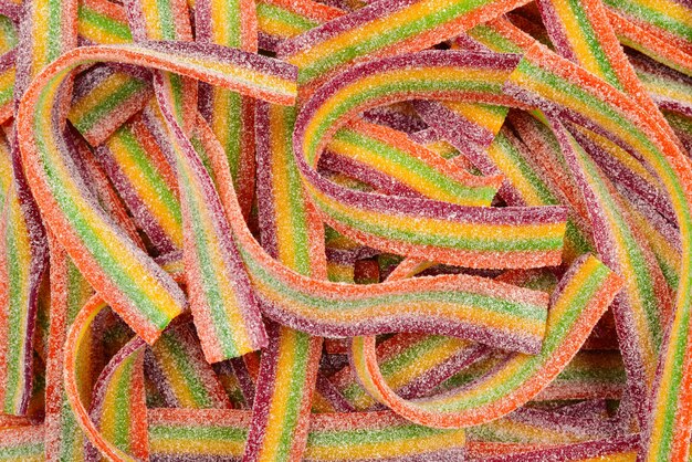 Foto bunte geleebohnen hintergrund. gelee-bonbons-muster.