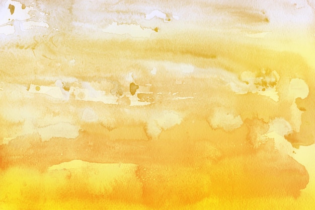 Bunte hellgelbe Aquarellstruktur auf weißem Papierhintergrund gemalt