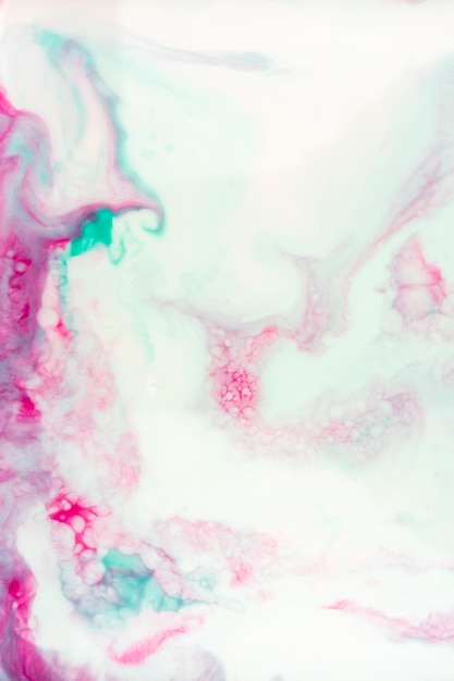 Foto buntes rosa geeen-blau mischt tinten, flüssige textur, rosa und blaue farbe in wasser
