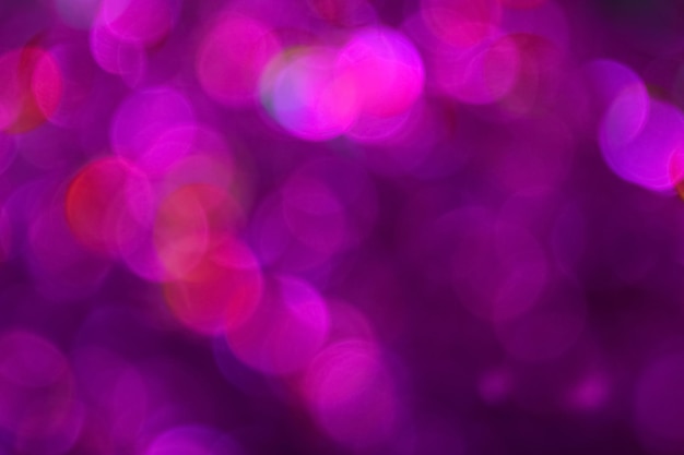 Buntes rosa und lila Bokeh defokussiert unscharfe Lichter und funkelt abstrakten Hintergrund