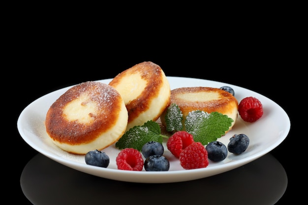 Buñuelos de requesón con bayas de frambuesa Desayuno tradicional Comida sabrosa y saludable