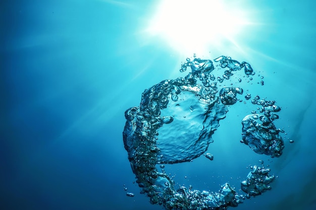 Burbujas de aire submarinas con luz solar. Burbujas de aire de fondo submarino