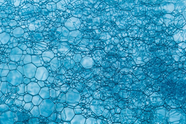 Burbujas de jabón azules Abstracto Macro espuma Fondo de primer plano Textura de la espuma de jabón