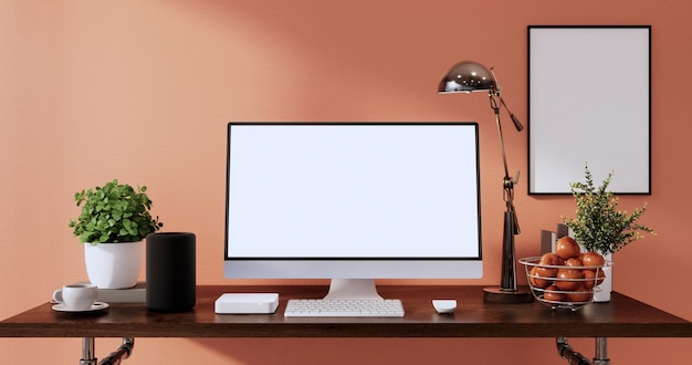 Burlarse de la pantalla de la computadora en blanco del escritorio de la mesa de oficina en la representación 3d de la habitación moderna de la oficina naranja