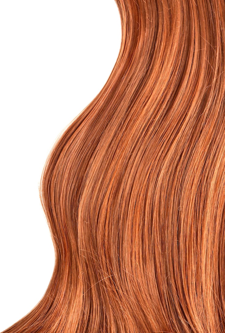 Foto cabello humano rojo largo y brillante