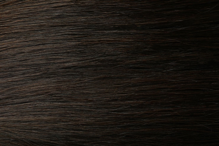 Foto cabelo feminino escuro em todo o fundo, close-up