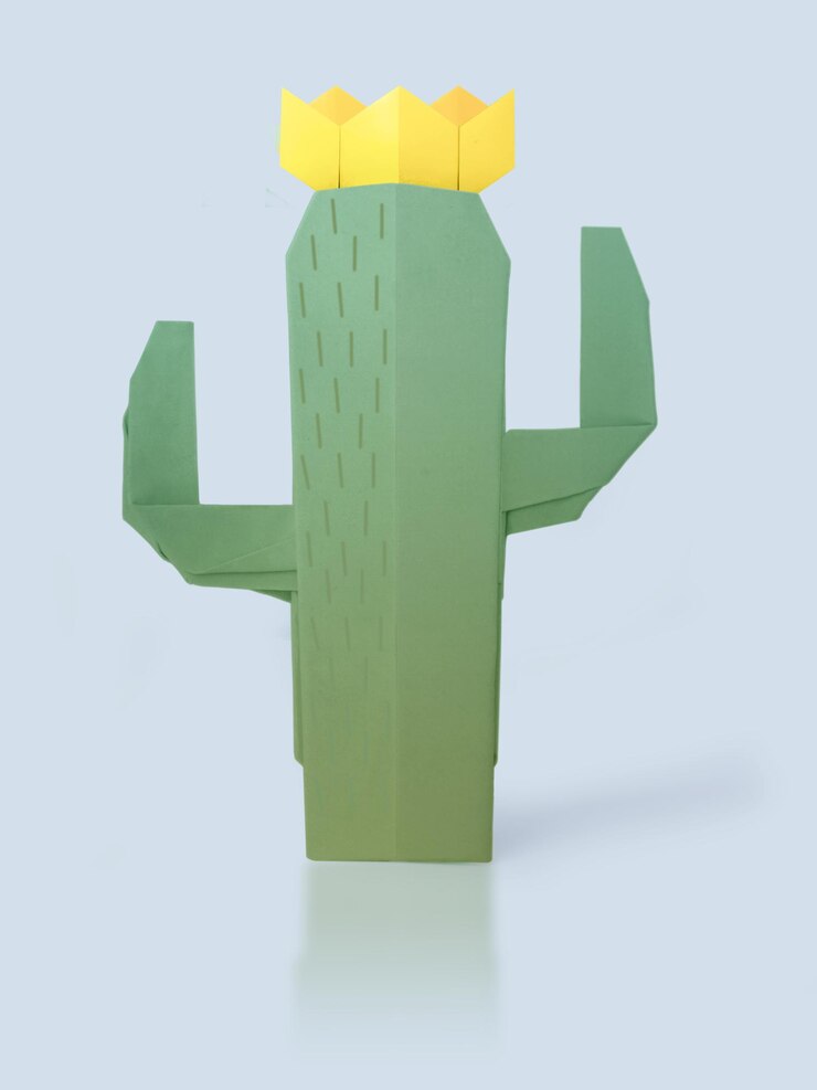 Cactus suculento de origami con flores amarillas sobre un fondo azul pálido