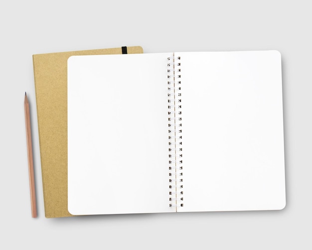 Caderno em branco e despertador vermelho no espaço de trabalho Mesa de escritório para conceito de negócios